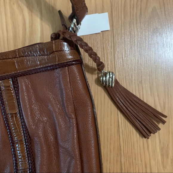 Brighton
Shoulder Bag Brown Leather Satchel
11"L x 3.5"W x 12"H - Picture 3 of 7